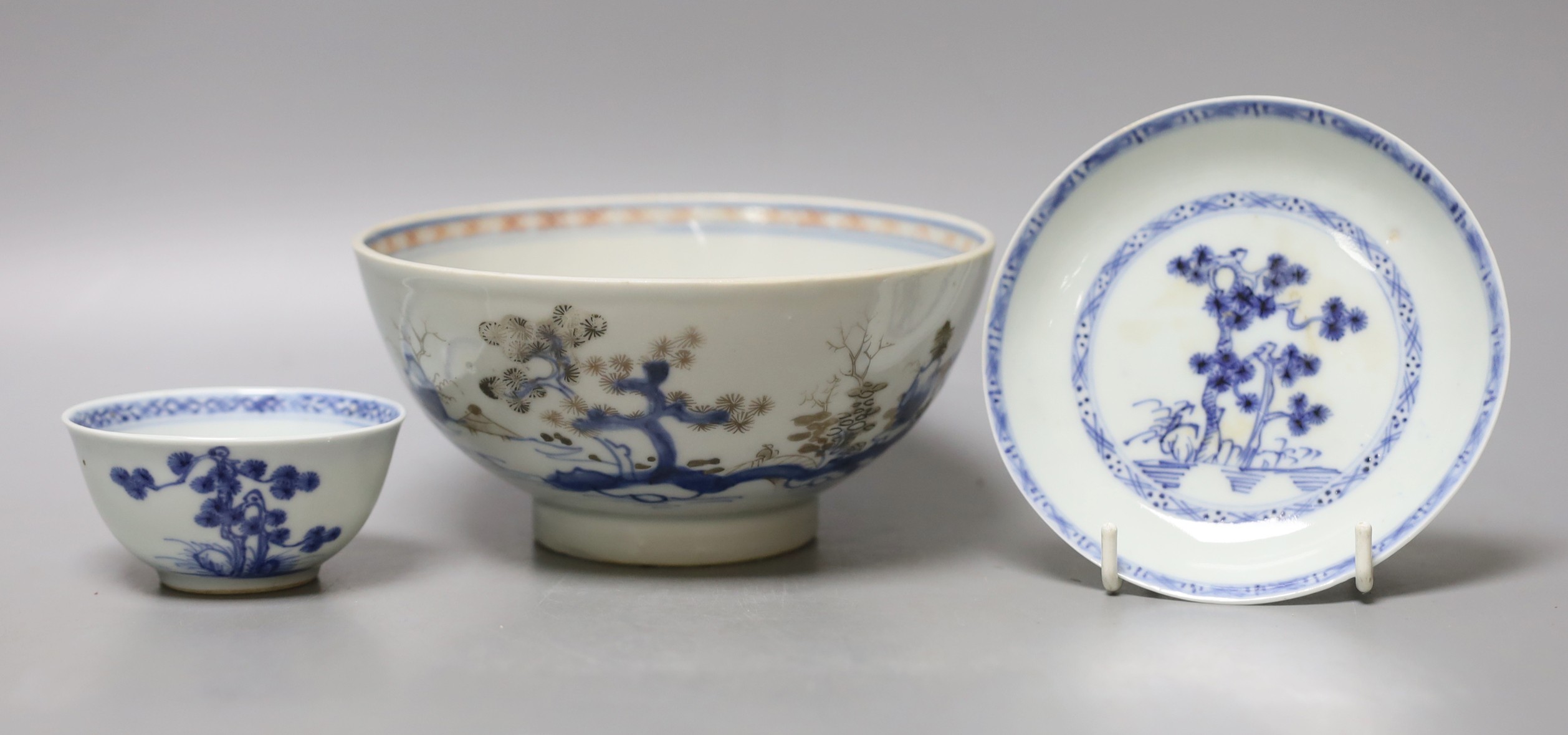 A Chinese Nanking cargo blue and white bowl and a tea bowl and saucer (Christie's label on base)